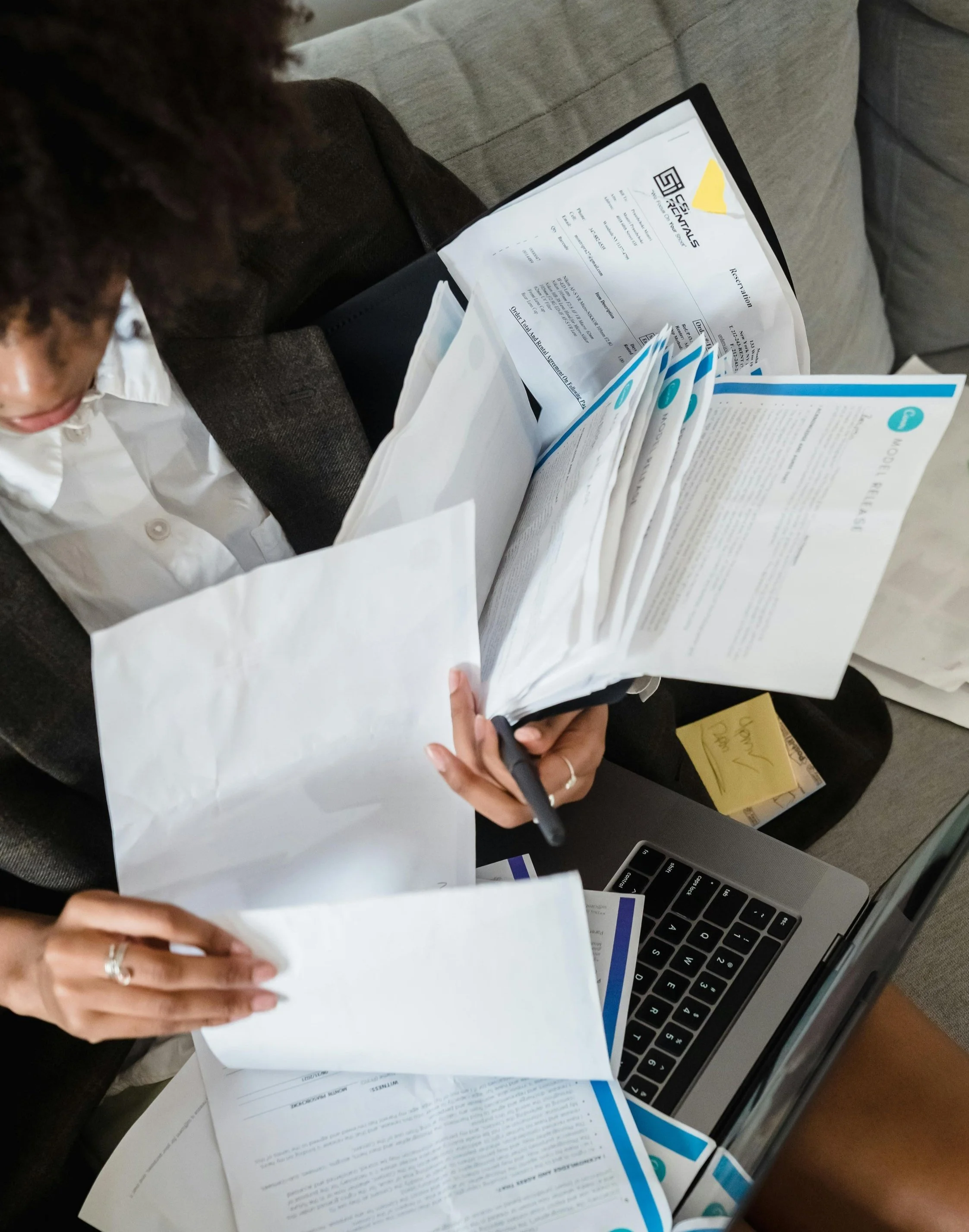 lady looking at multiple documents